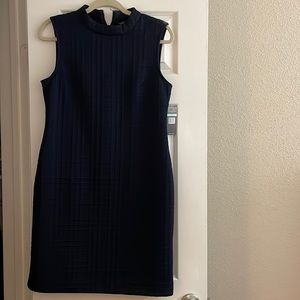 Navy blue dress with high neck. New with tag. Size 8.